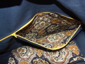 14" inside zipper pocket &  10" slipper pocket